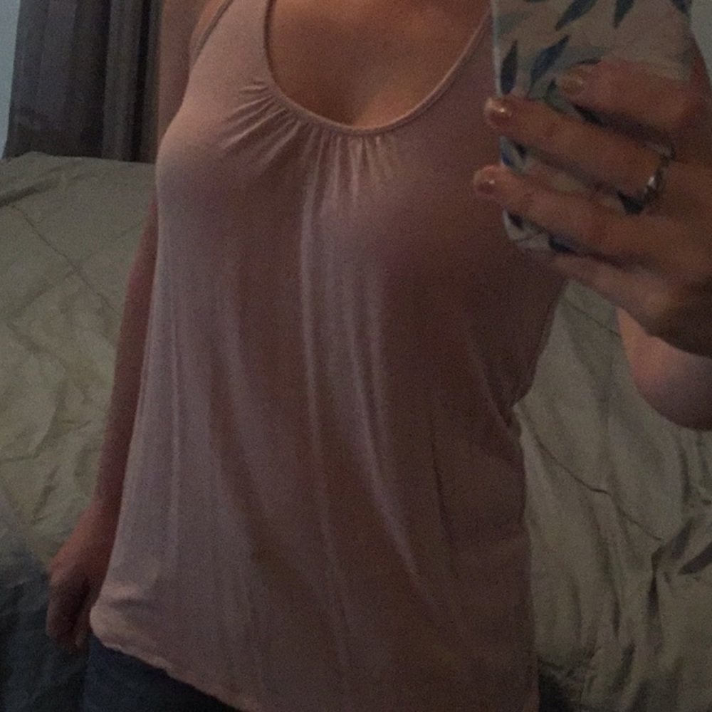 Woman’s small light pink tank. Cute back